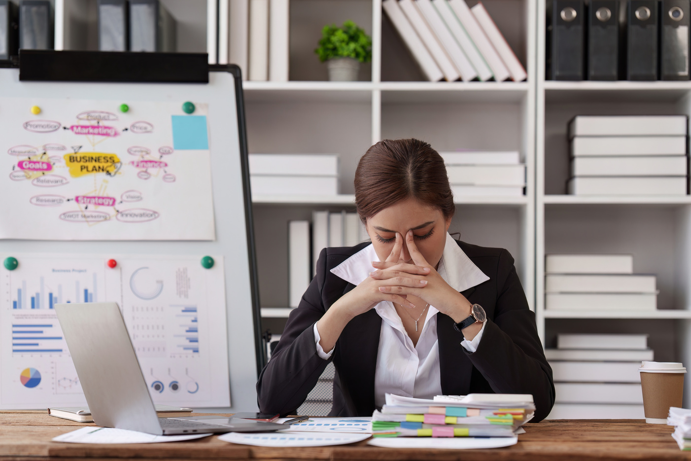 Deadline with young business woman feeling stressed concept. Business woman working at office, business finance concept