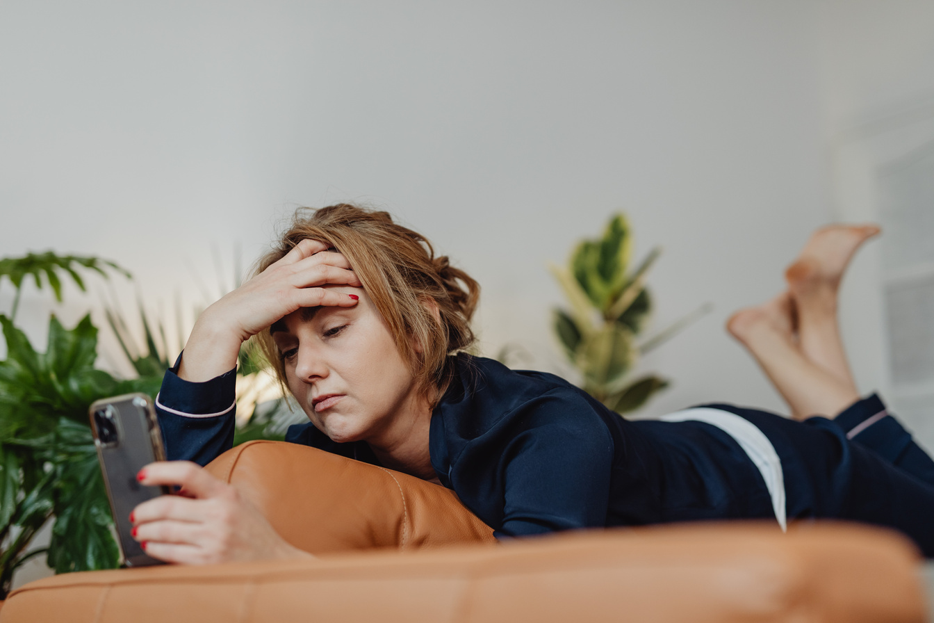 Stressed Woman Looking at her Cellphone