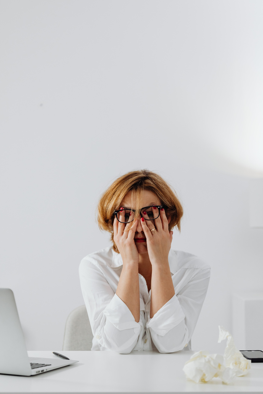 Sad Woman with Hands on Face